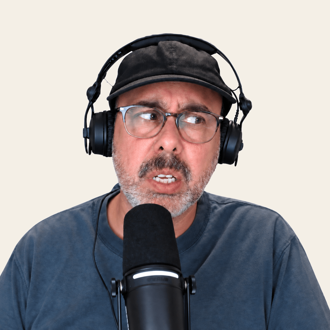 Deep wearing headphones and speaking into a microphone